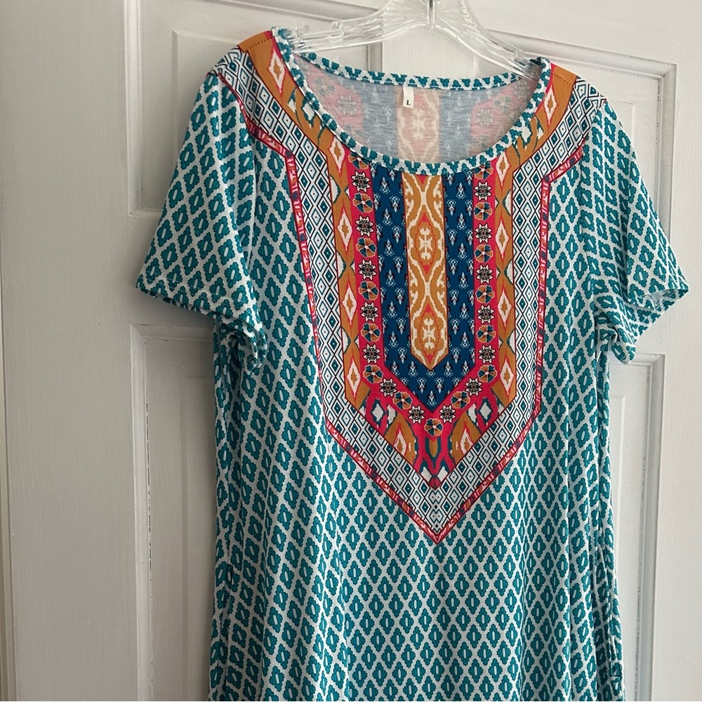 Very cute pattern dress cotton and polyester.